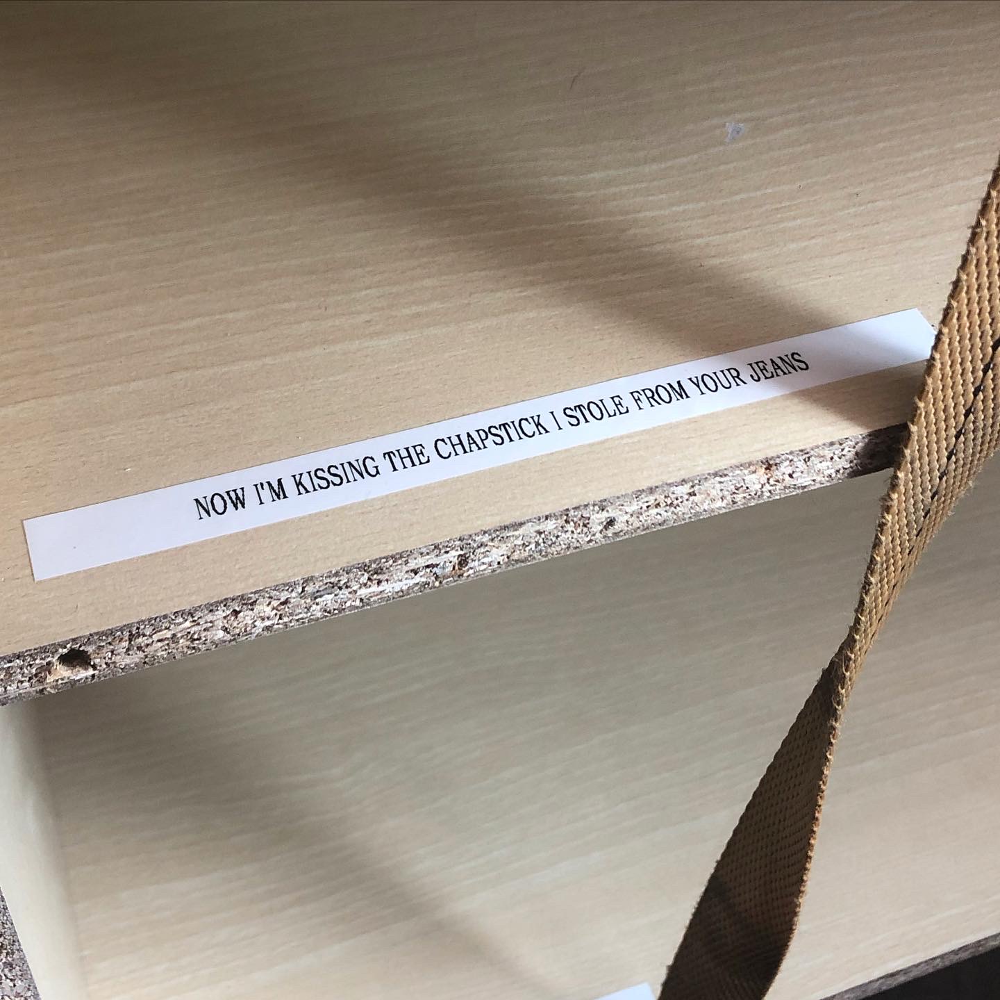 inside the cabit, there is more label maker text visible along with cheap exposed material board